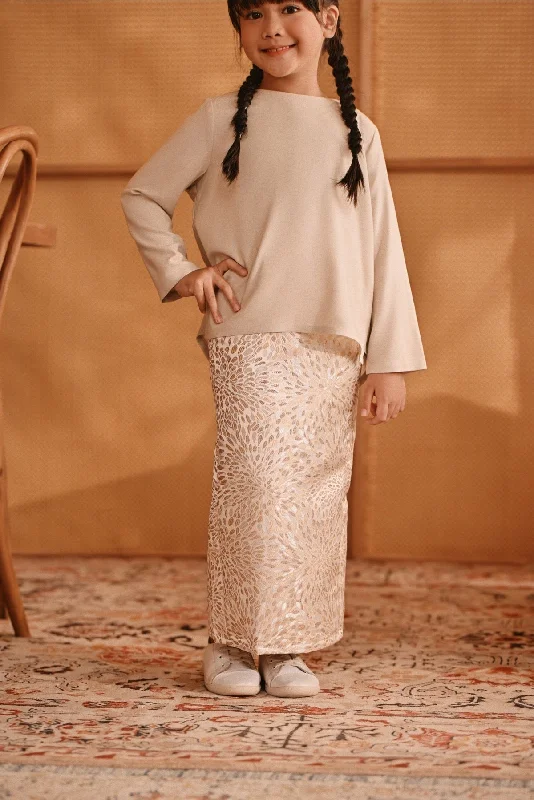The Nest Jacquard Skirt - Spring Sand asymmetrical skirt cut