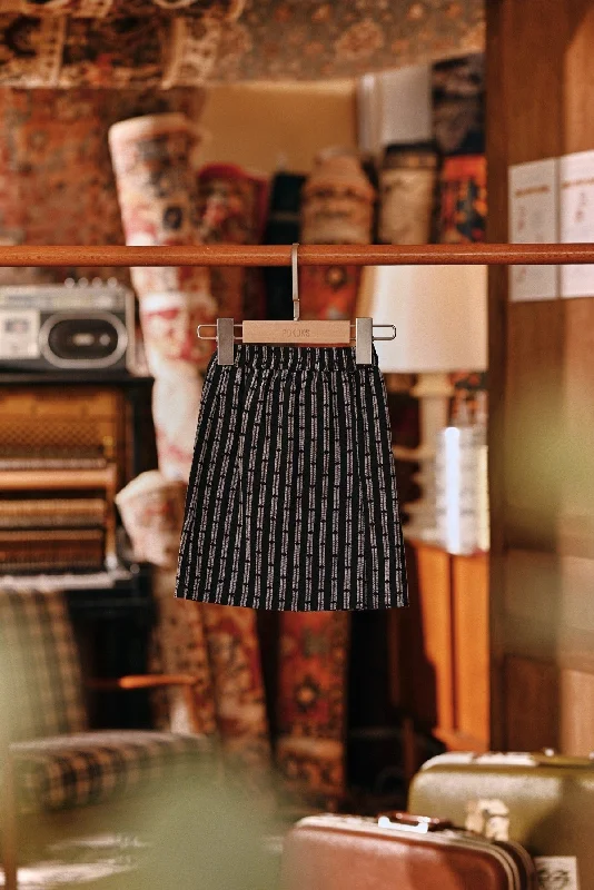 The Akar Kita Babies Folded Skirt - Black Streak flowy skirt hem