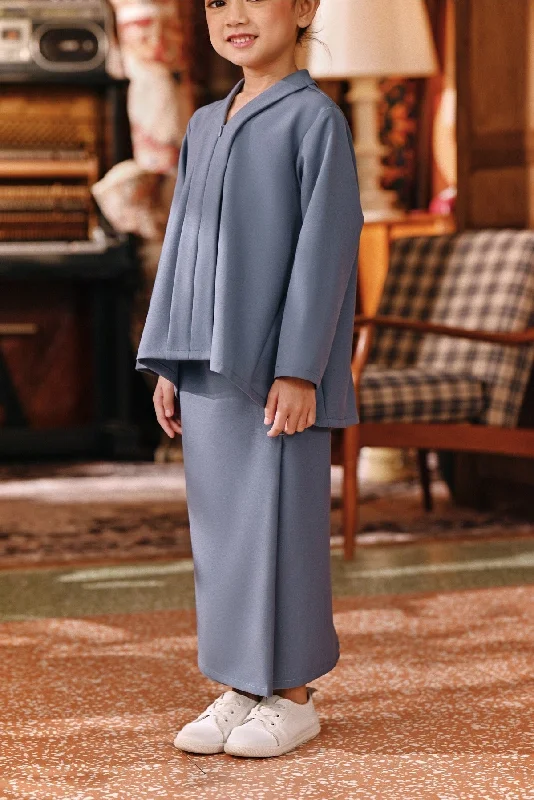 The Akar Kita Folded Skirt - Coronet Blue button skirt front